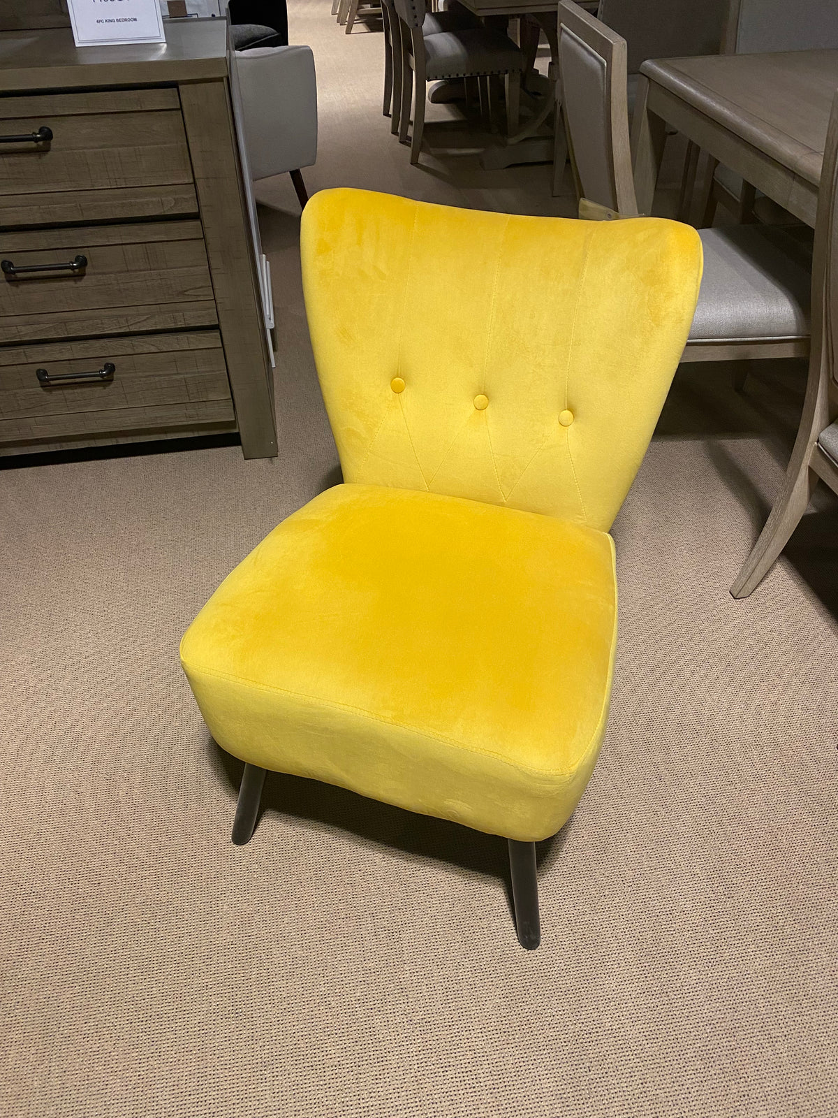 Model 1166YW yellow upholstered accent chair with button-tufted back and dark legs