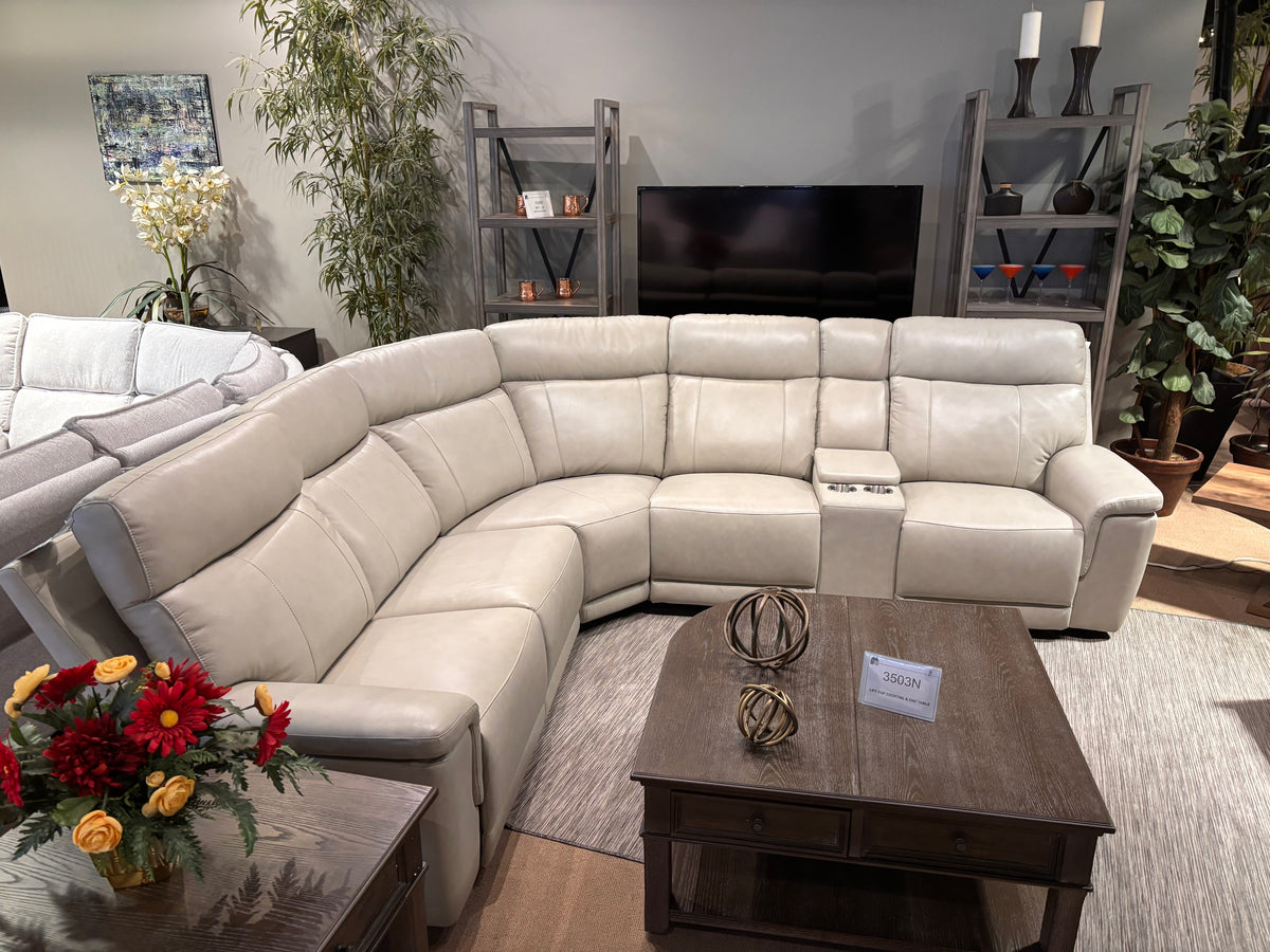Model 9199TPE taupe reclining sectional shown from the front in showroom