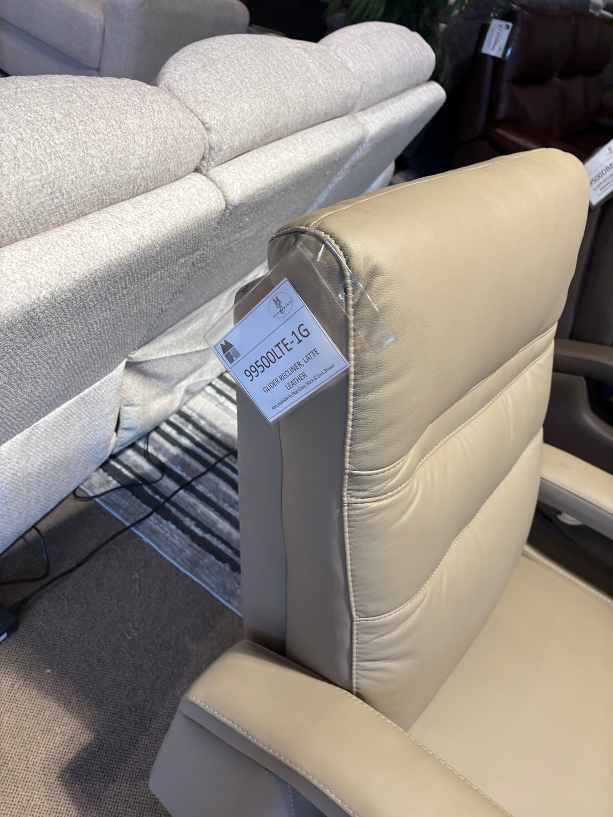 Model 99500 beige leather swivel recliner chair detail view