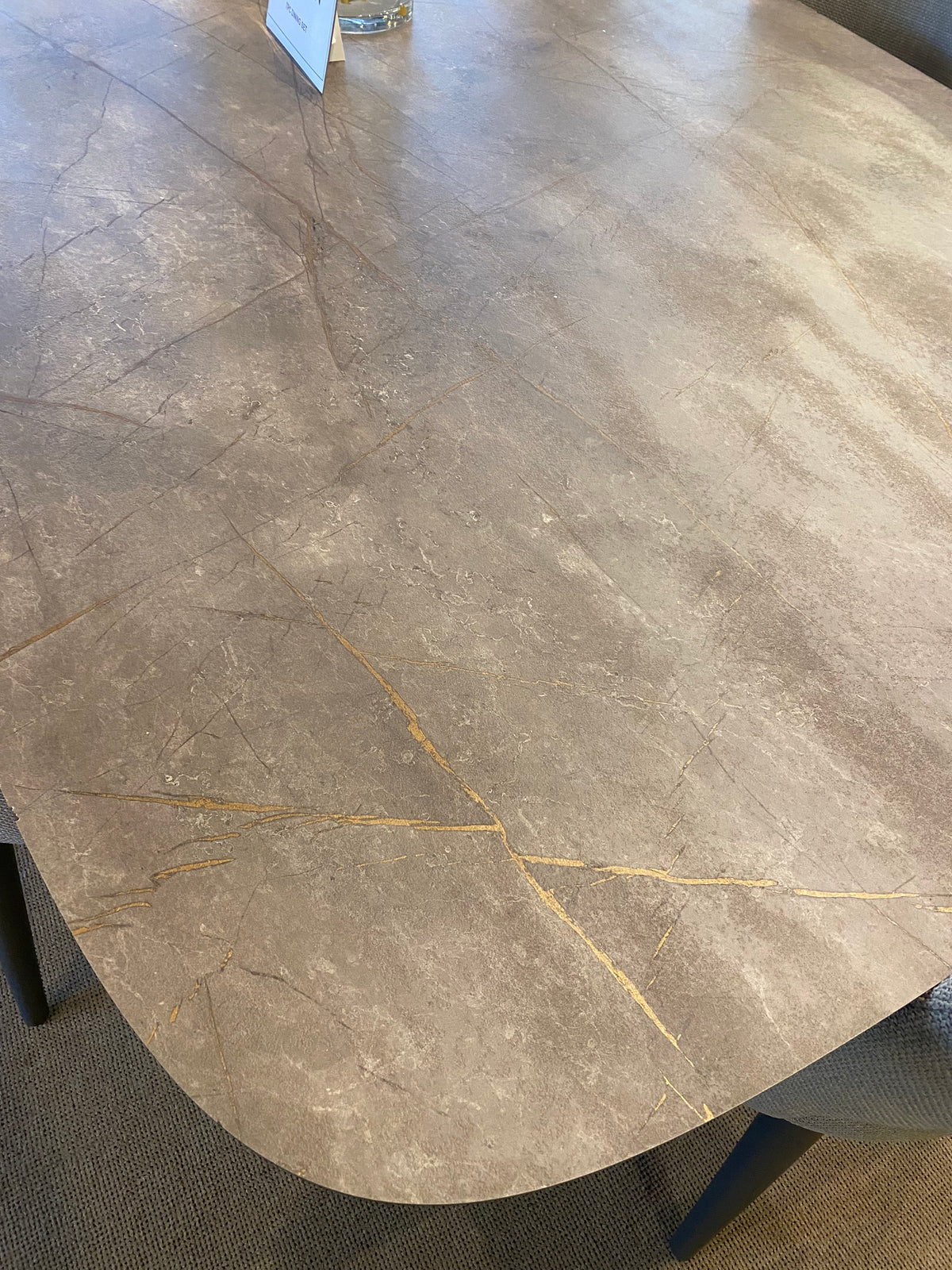 Model Hexagon Italian dining set close-up of stone-look tabletop