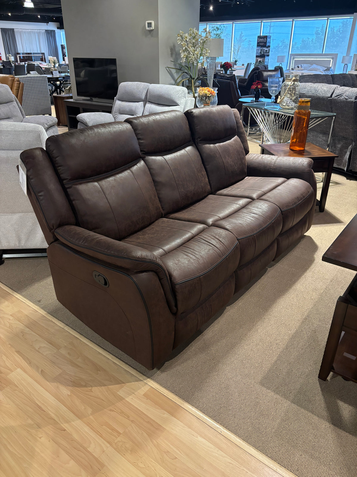 Model 99902BRW brown reclining sofa with plush padded headrests
