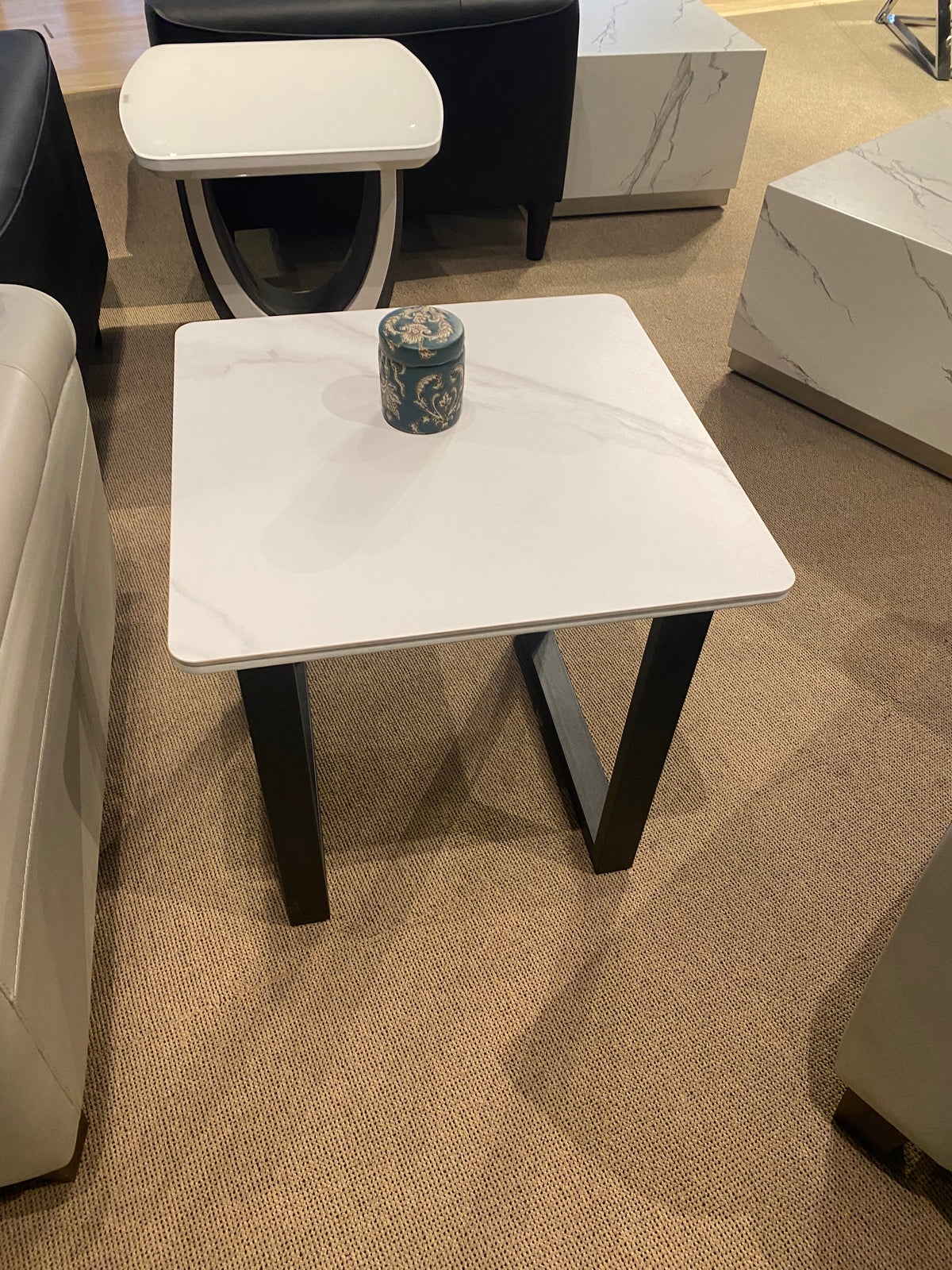 Model 5915 white marble-look end table with black base