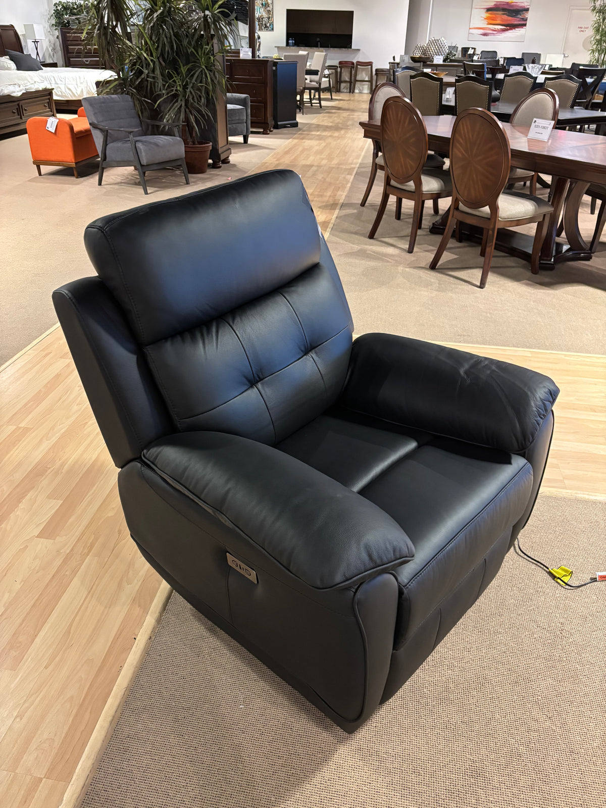Model 99032P light leather power recliner sofa and loveseat set, showroom view