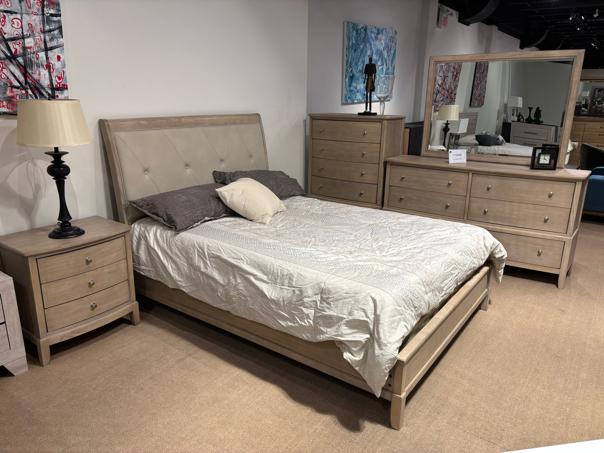 Model 1730NB light wood bedroom set with upholstered bed, dresser, mirror, nightstand, and chest