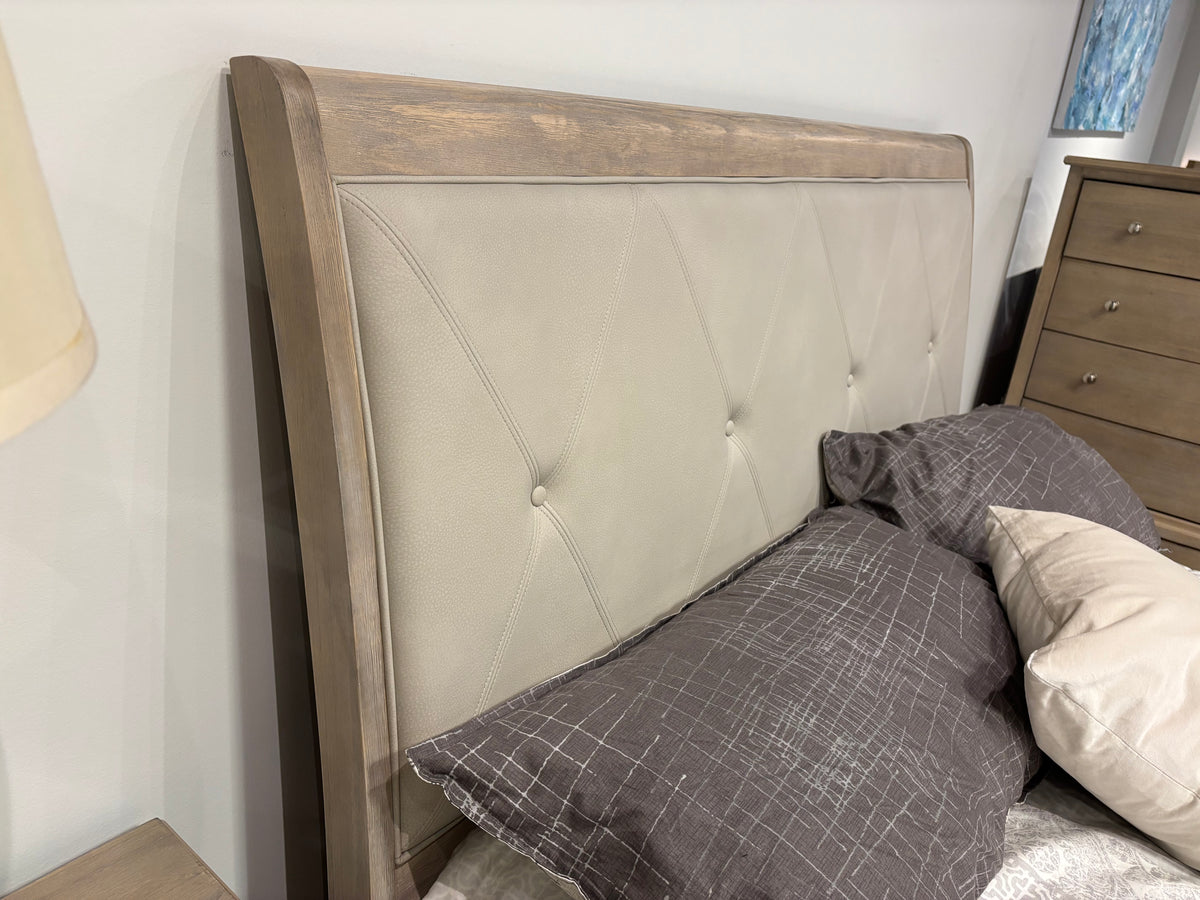 Model 1730NB light wood bed with upholstered button-tufted headboard