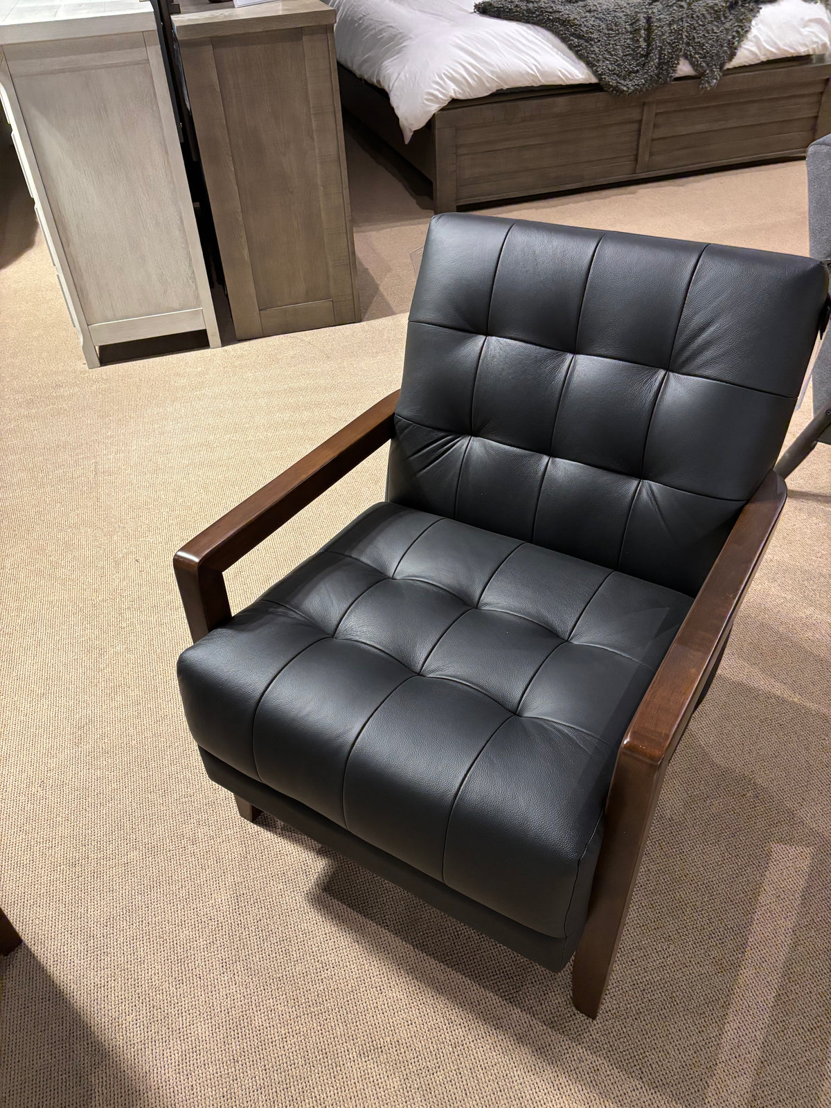 Model 1010 light grey leather accent chair with tufted cushions and wood arms