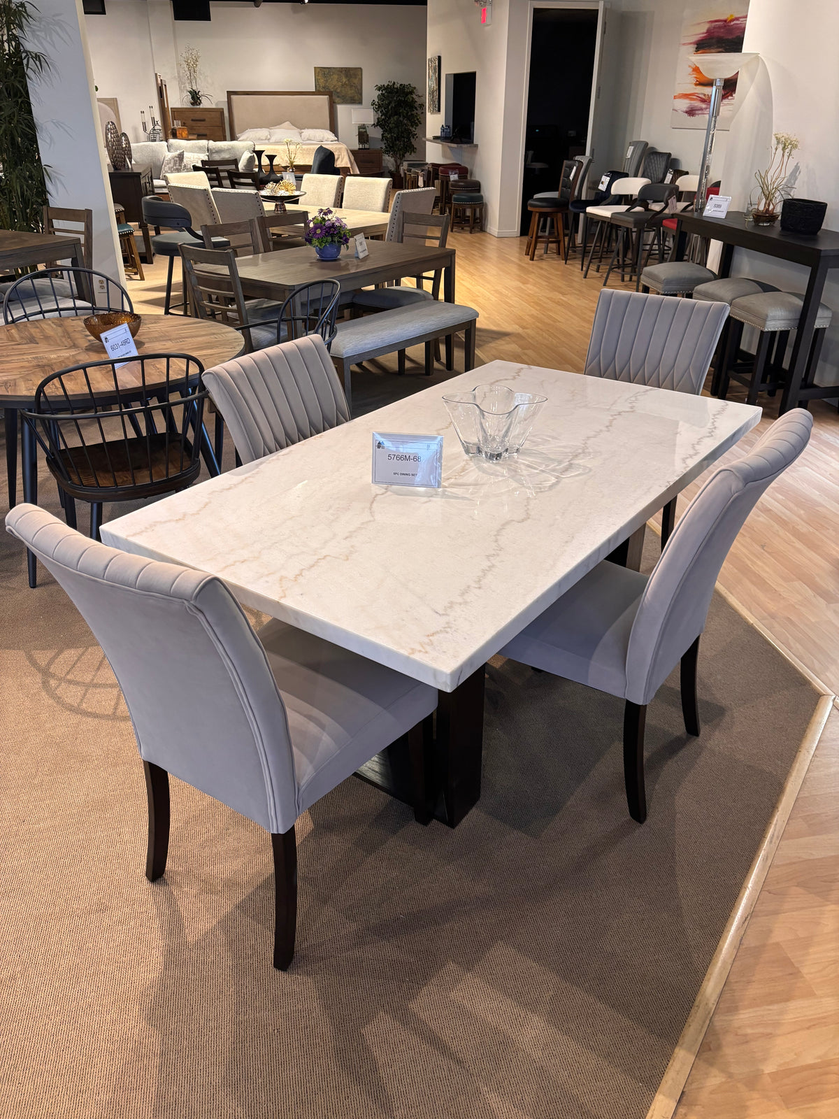 Model 5766M white marble-top dining table with six grey upholstered chairs