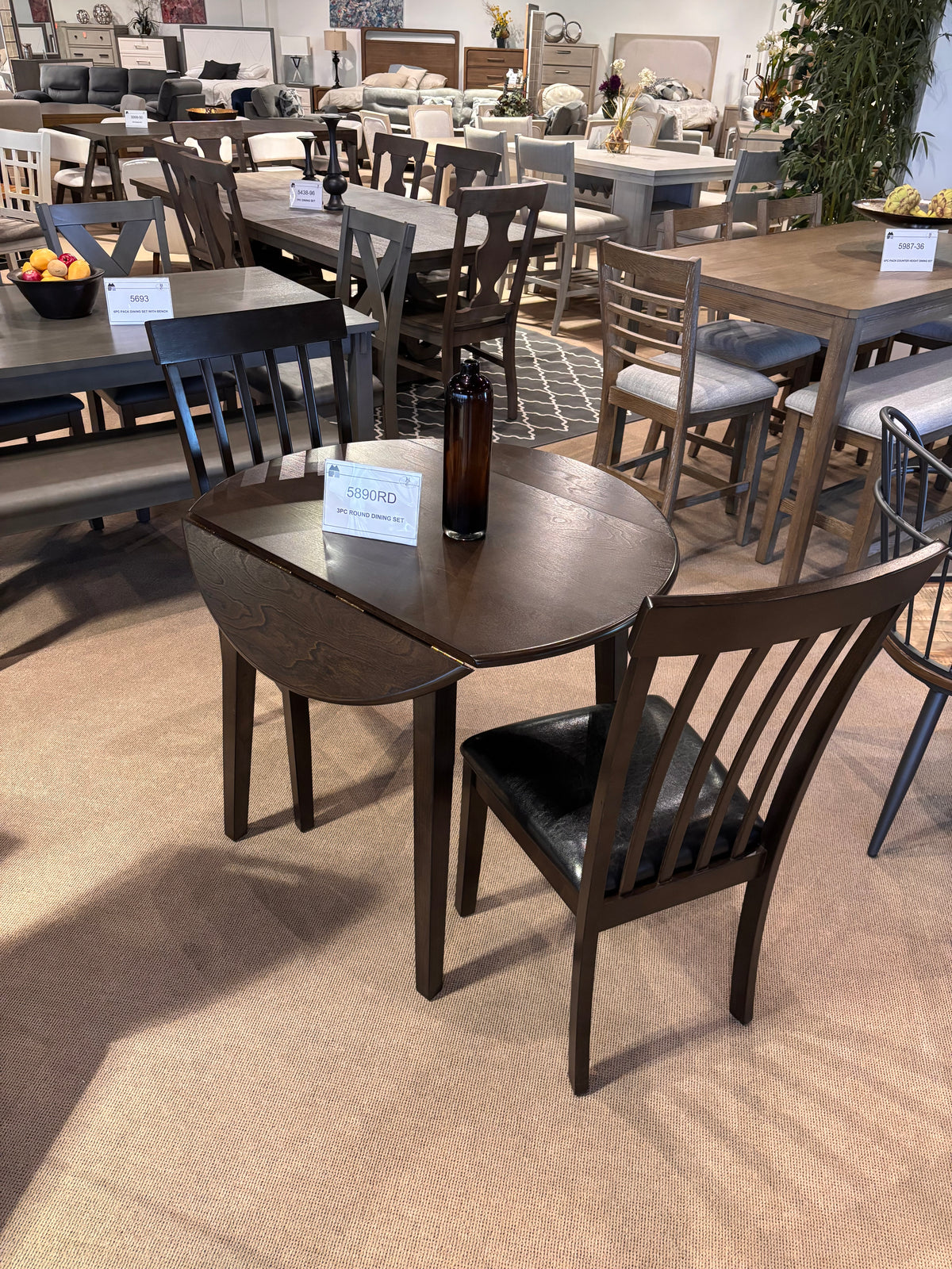 Model 5980RD dark wood drop-leaf round table with two chairs