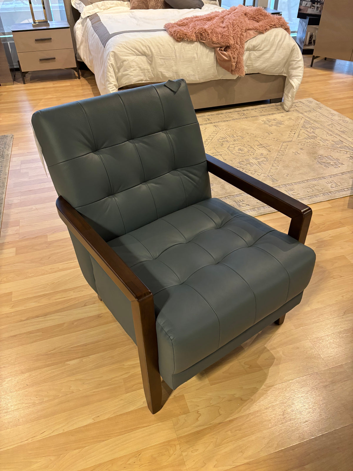Model 1010 dark grey leather accent chair with tufted cushions and wood arms