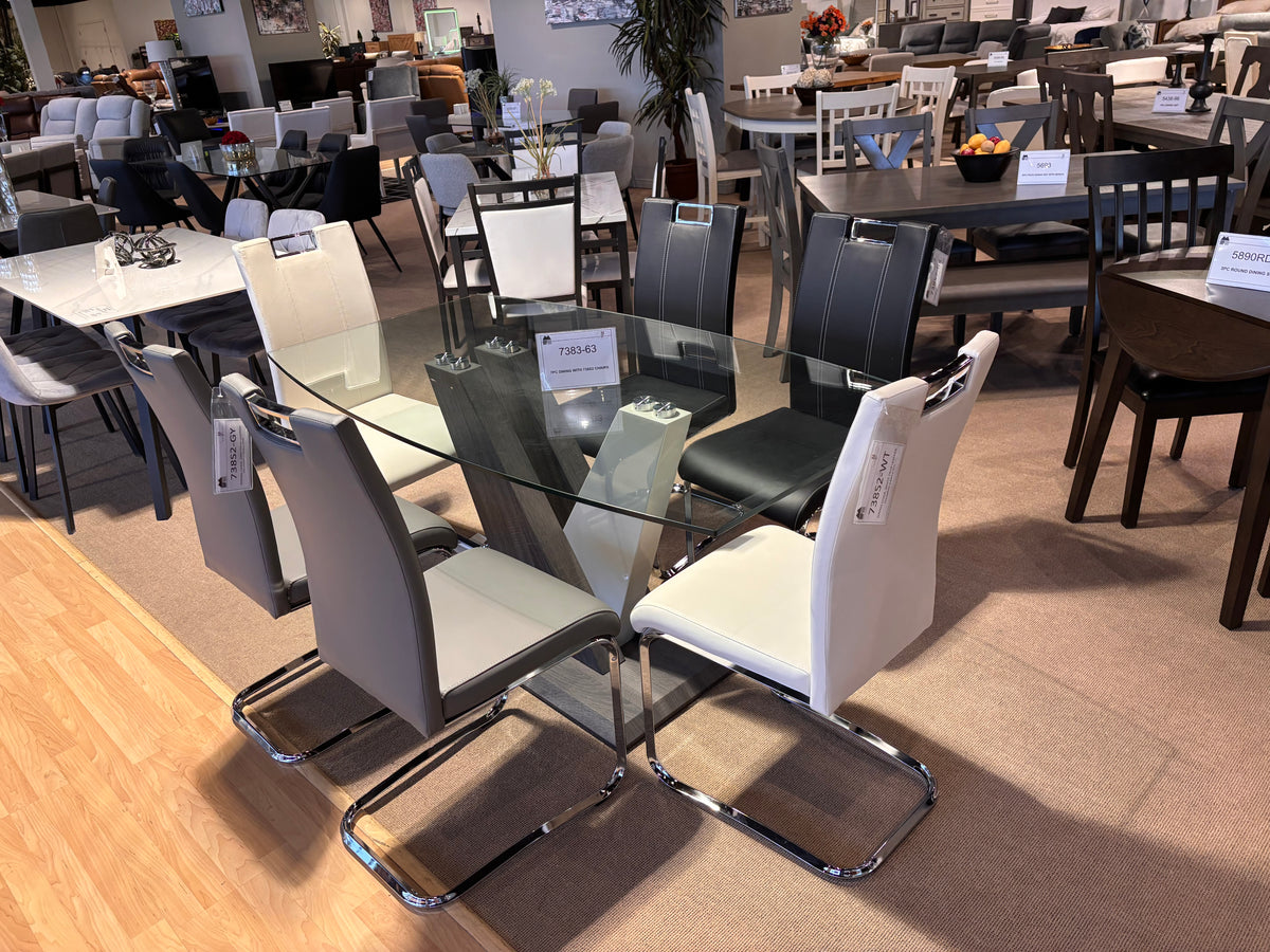 Model 7383 glass dining table with black, grey and white cantilever chairs