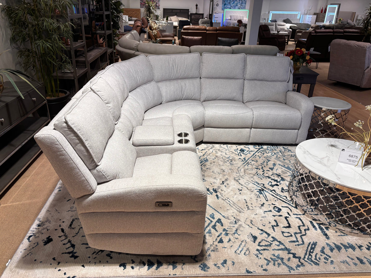 Model 98406LGYSS light-grey reclining sectional with storage console and cup holders in showroom