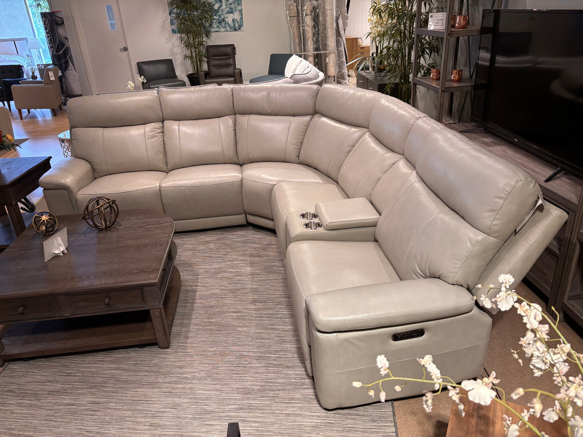 Model 9199TPE taupe electric power reclining sectional with storage console and cup holders in showroom