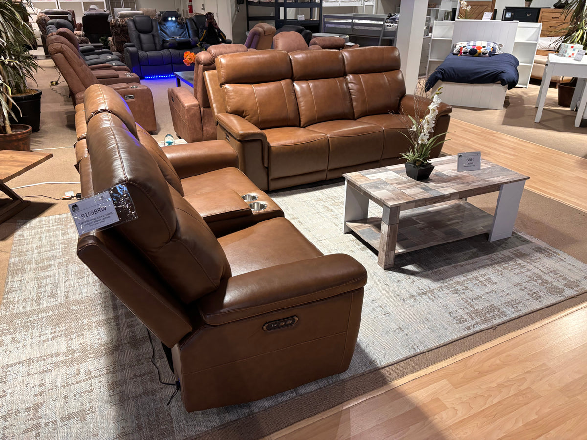 Model 9199BW brown leather dual power reclining sofa and loveseat shown from the side in showroom