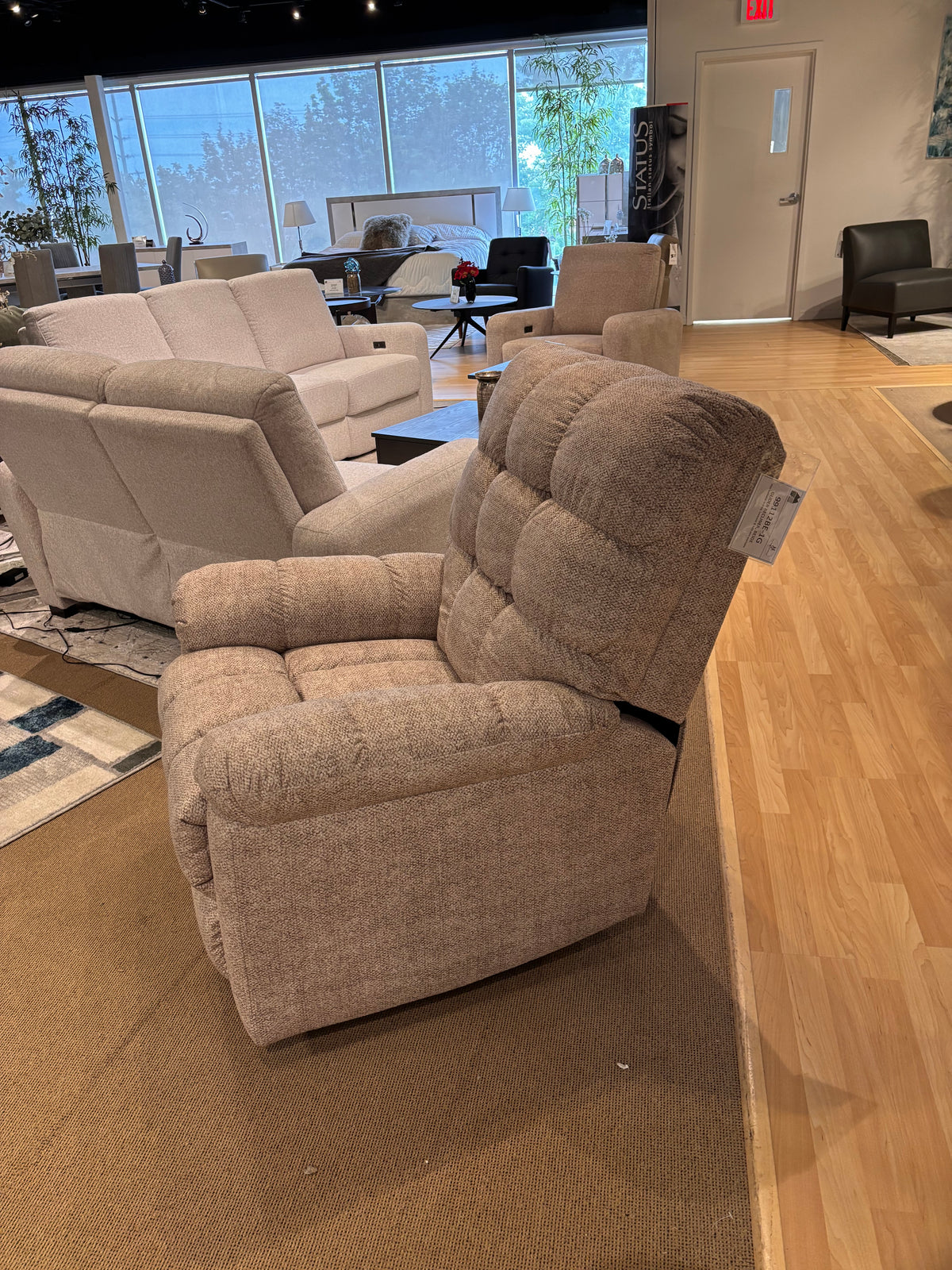 Model 99112 beige fabric recliner upholstery and product label detail