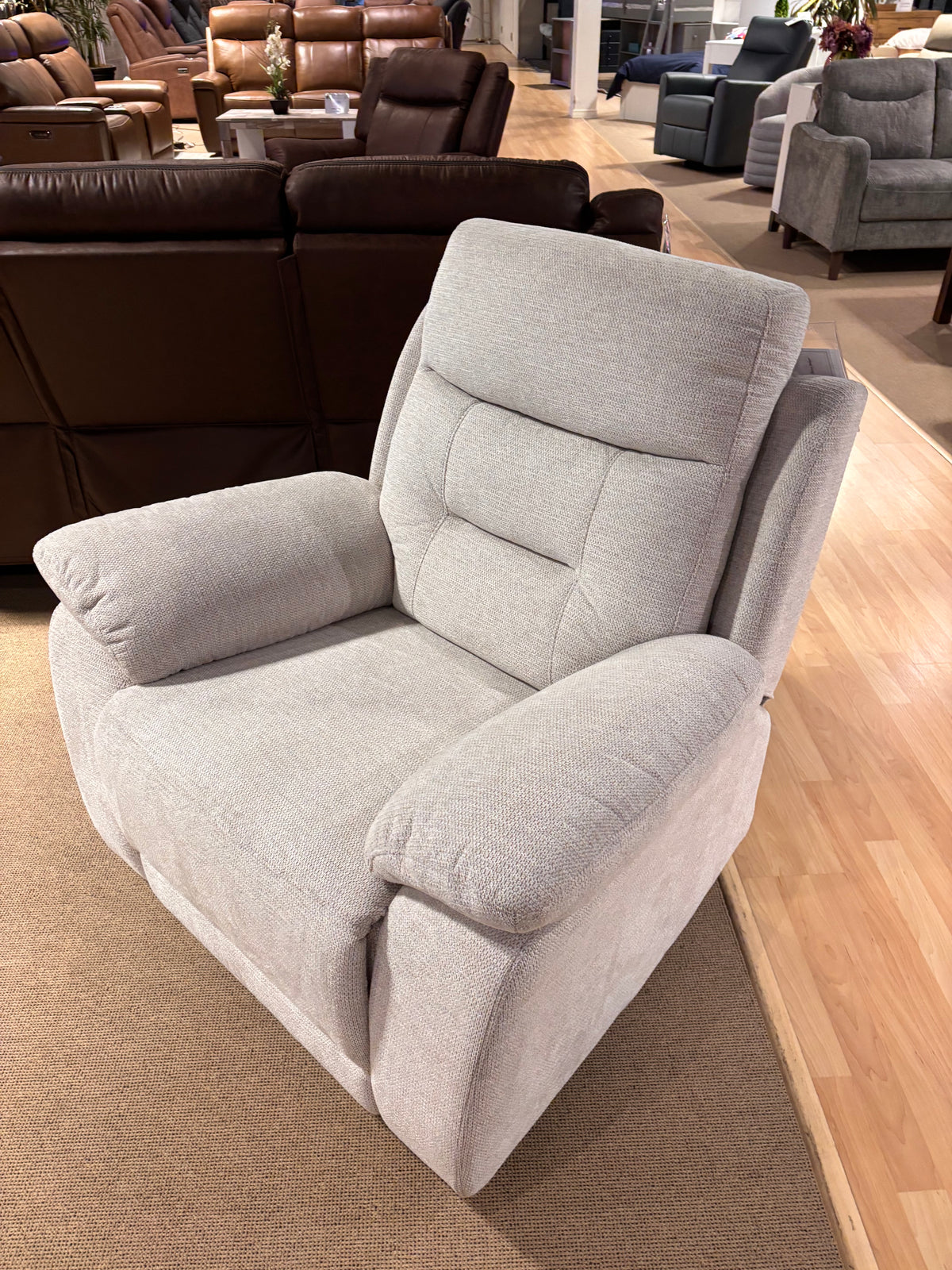 Model 9146 light-grey fabric recliner chair shown from the front in showroom