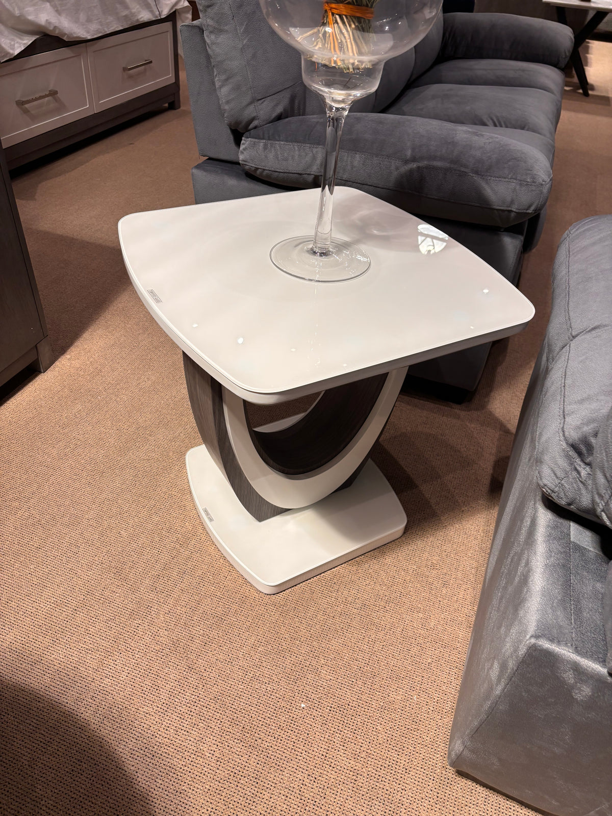Model 5922 coffee table with white top and curved base