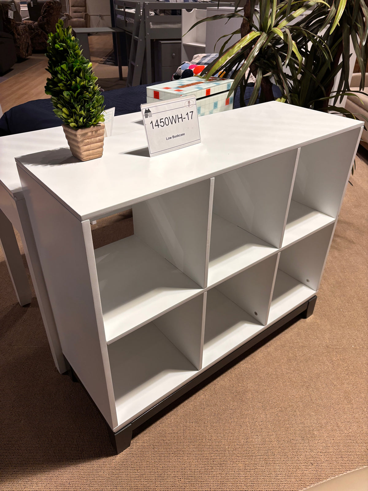 Model 1450WH-17 low white bookshelf with six open storage compartments and dark base