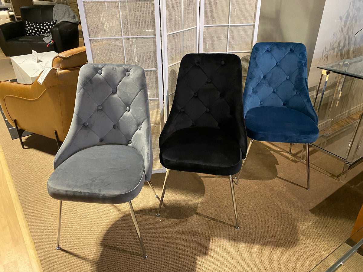 Model 1321 black velvet dining chair with button-tufted back and metal legs