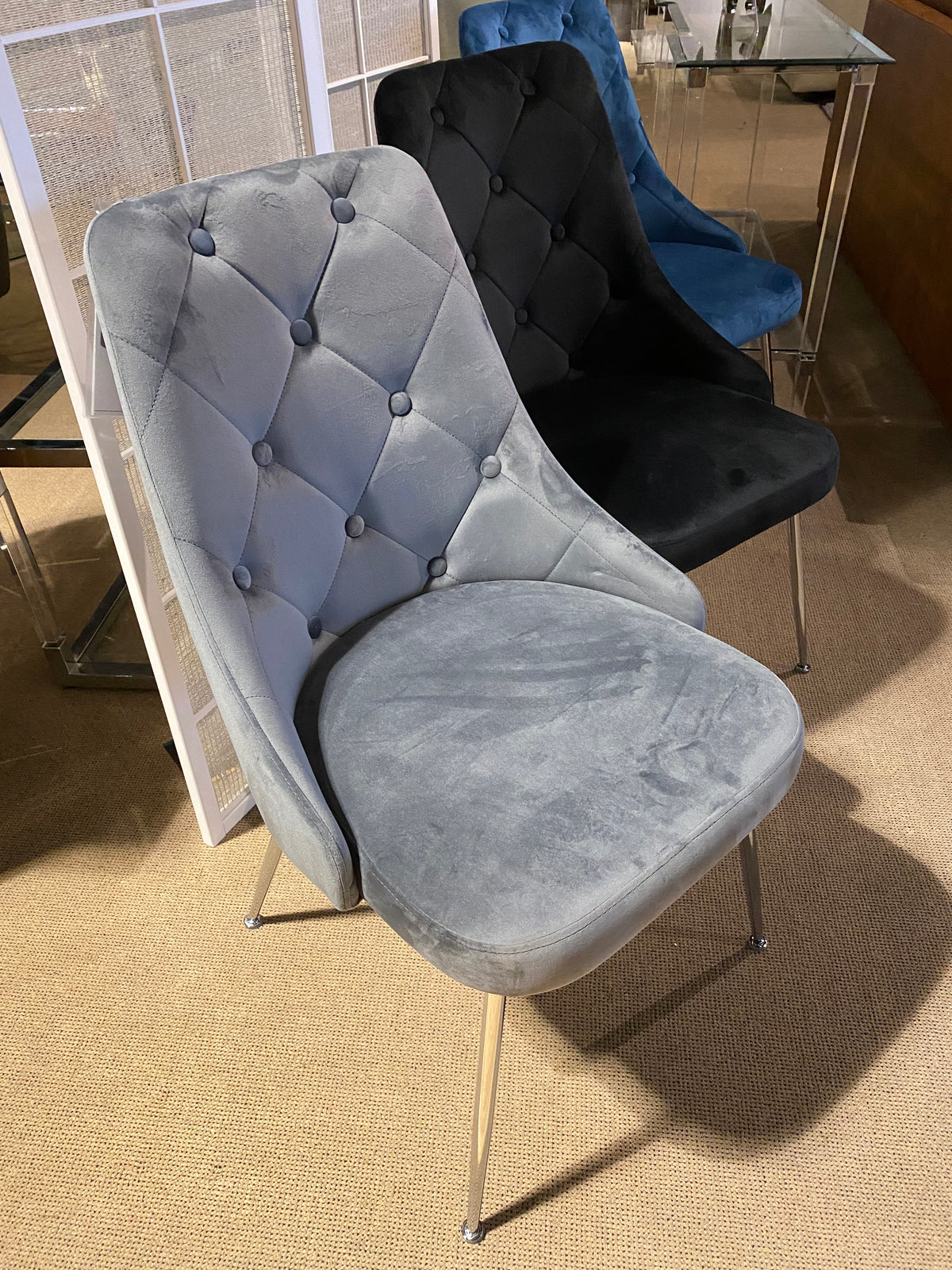 Model 1321 tufted dining chairs shown in grey, black, and blue