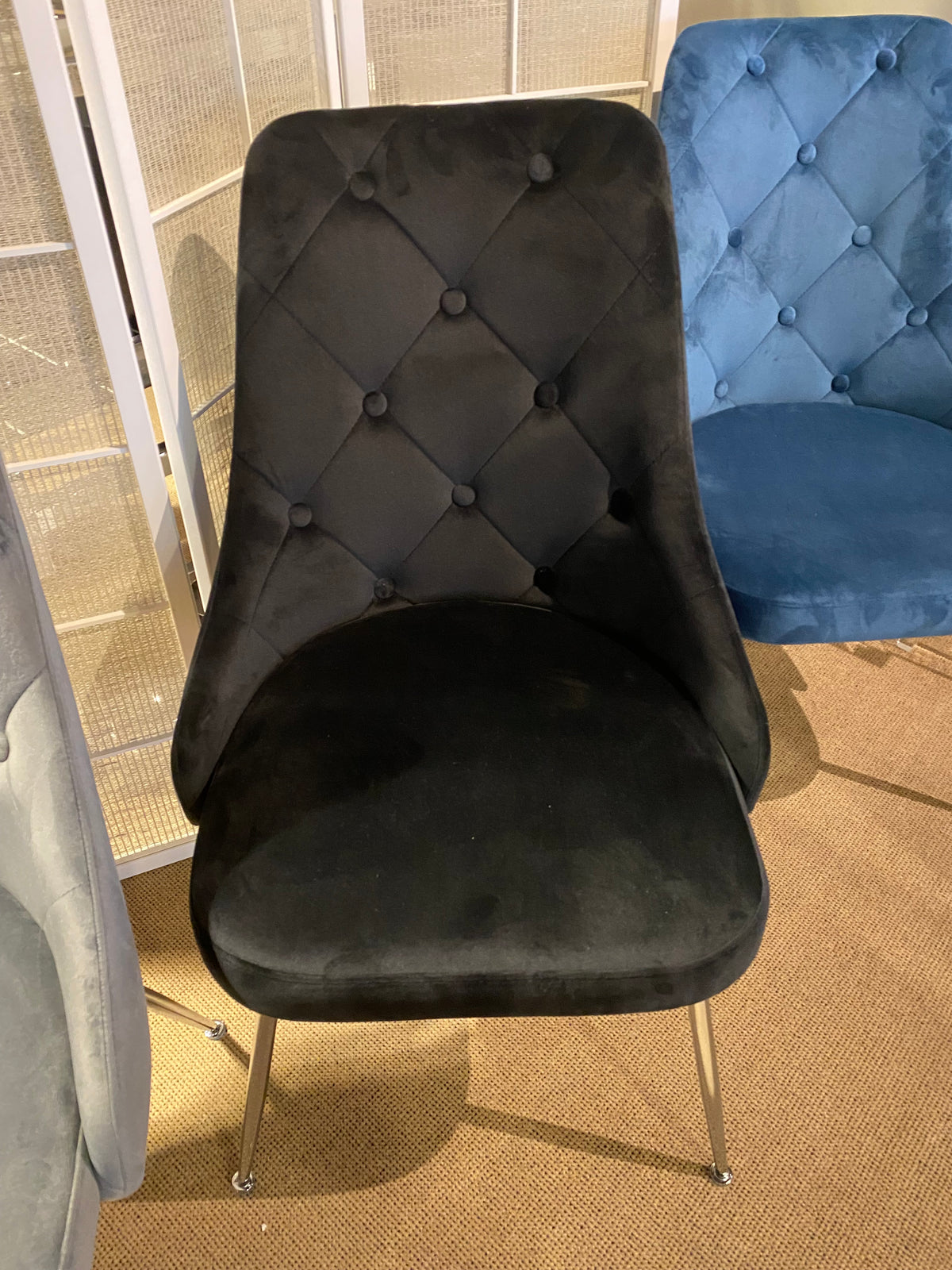 Model 1321 blue velvet dining chair with button-tufted back and metal legs