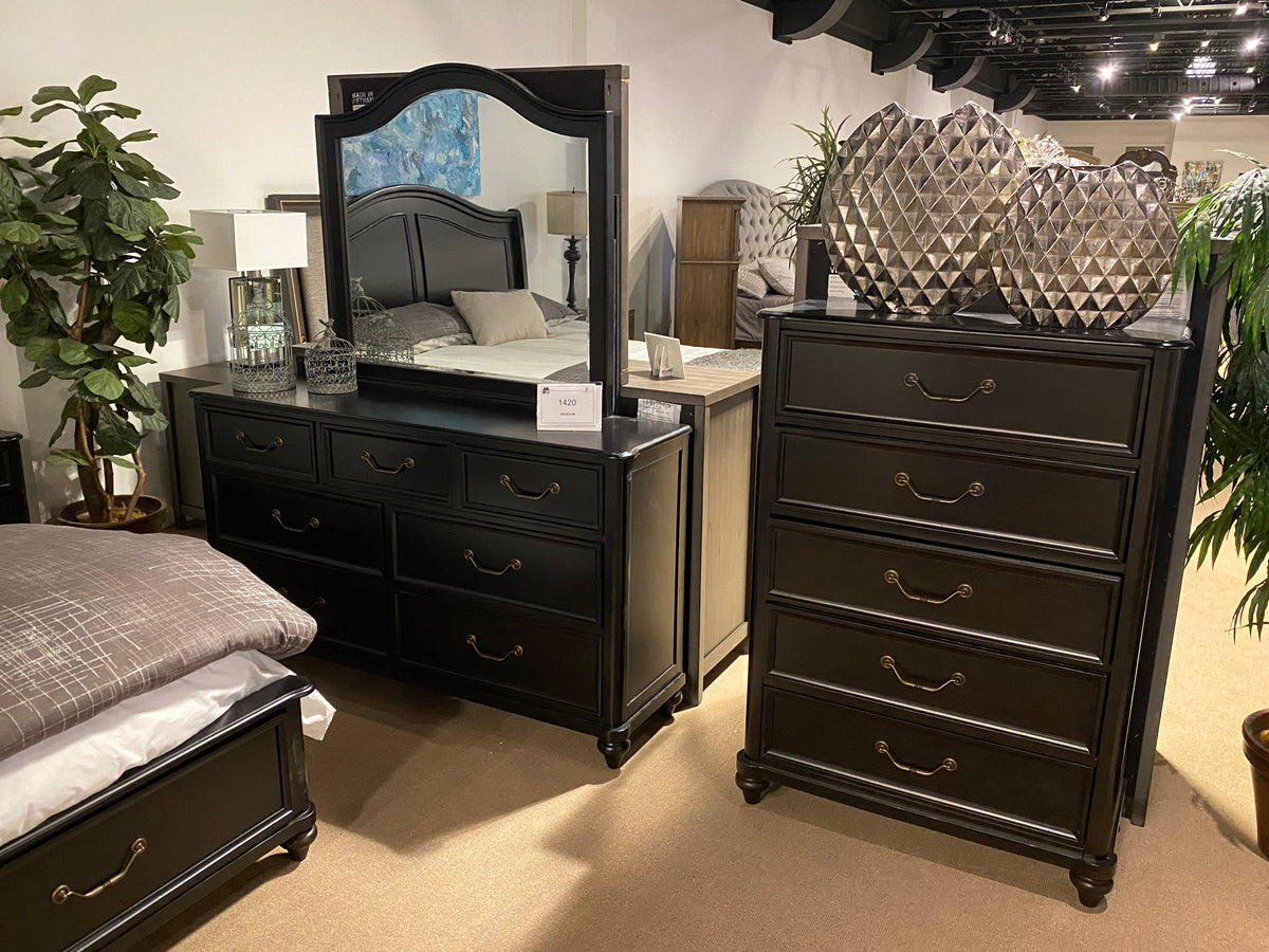 Close-up of Model 1420 dark wood bed with curved panel headboard