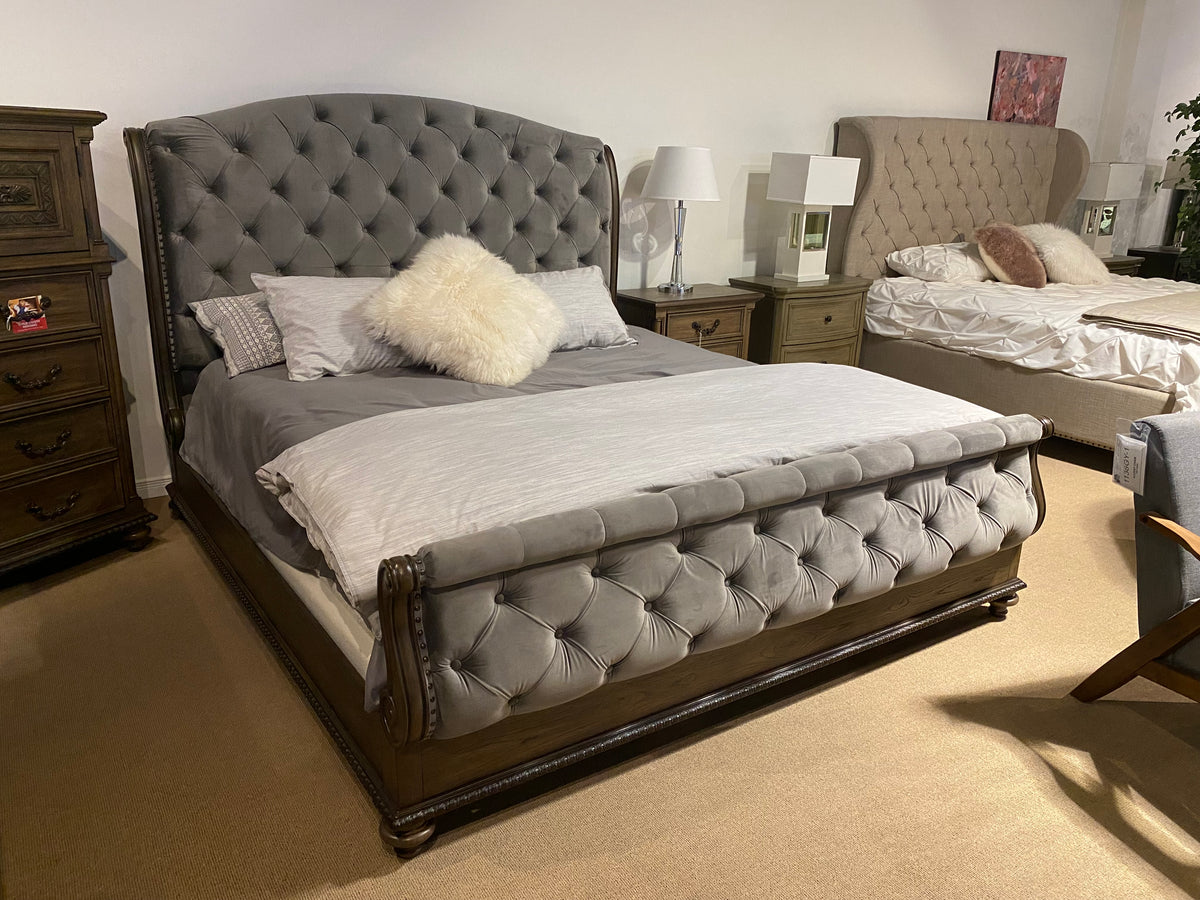 Model 1693 bedroom set with grey tufted velvet wingback bed, matching tufted footboard, and traditional wood frame