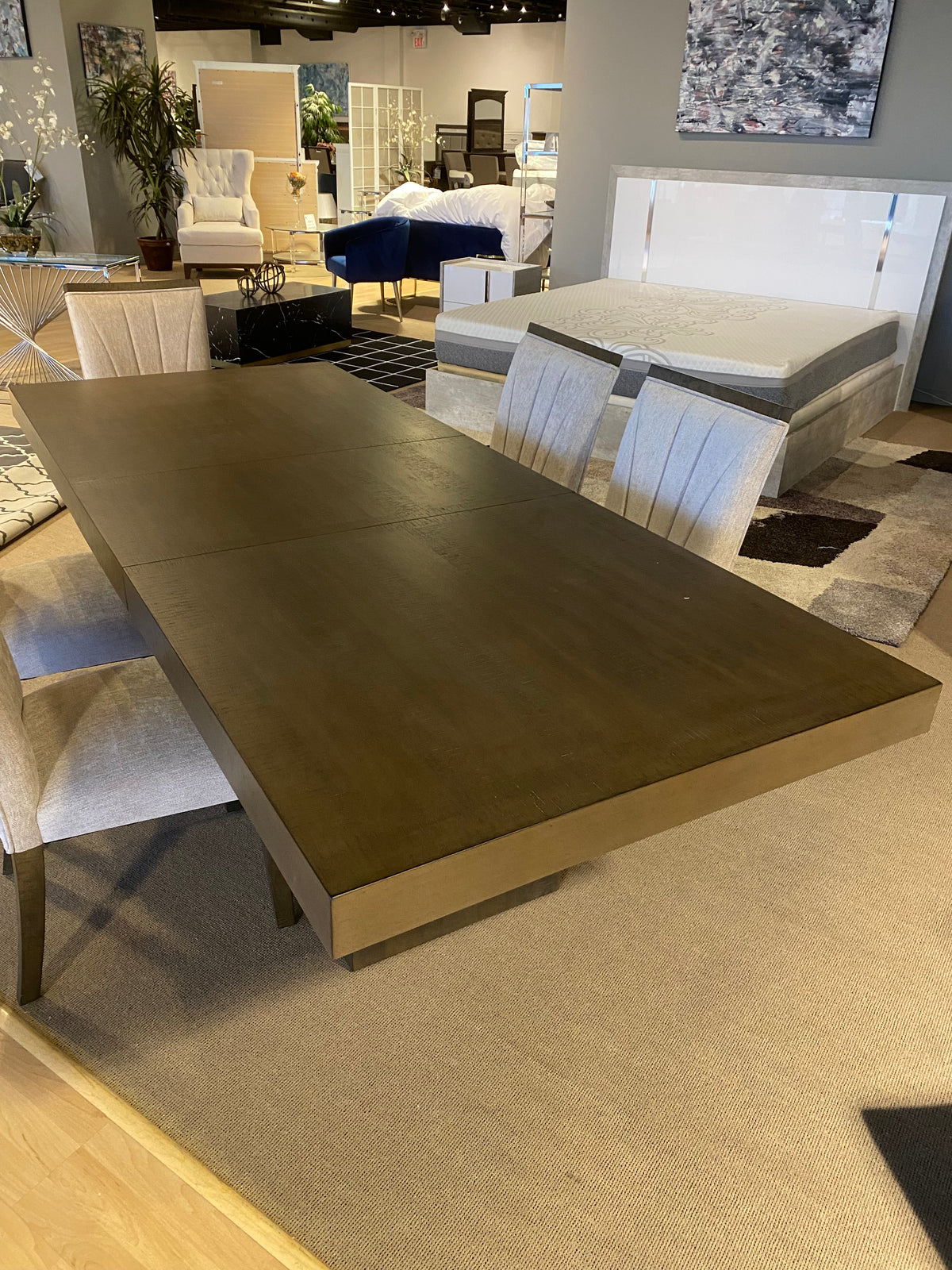 Model 5764 dark wood dining table and upholstered chairs close view