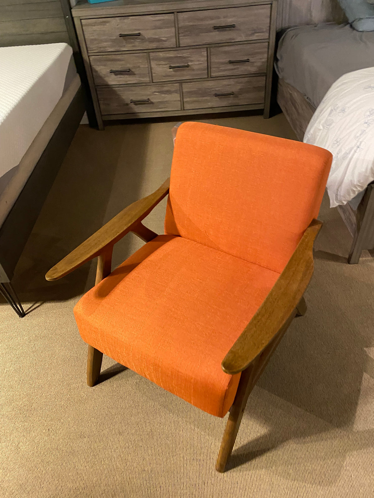 Model 1138 orange upholstered accent chair with wooden arms and legs