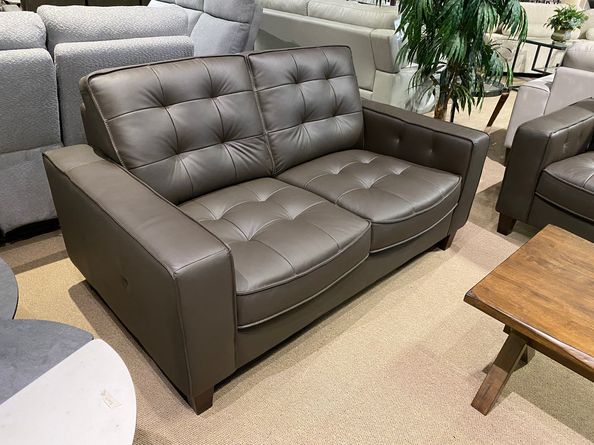 Model 99266 brown leather loveseat with tufted cushions
