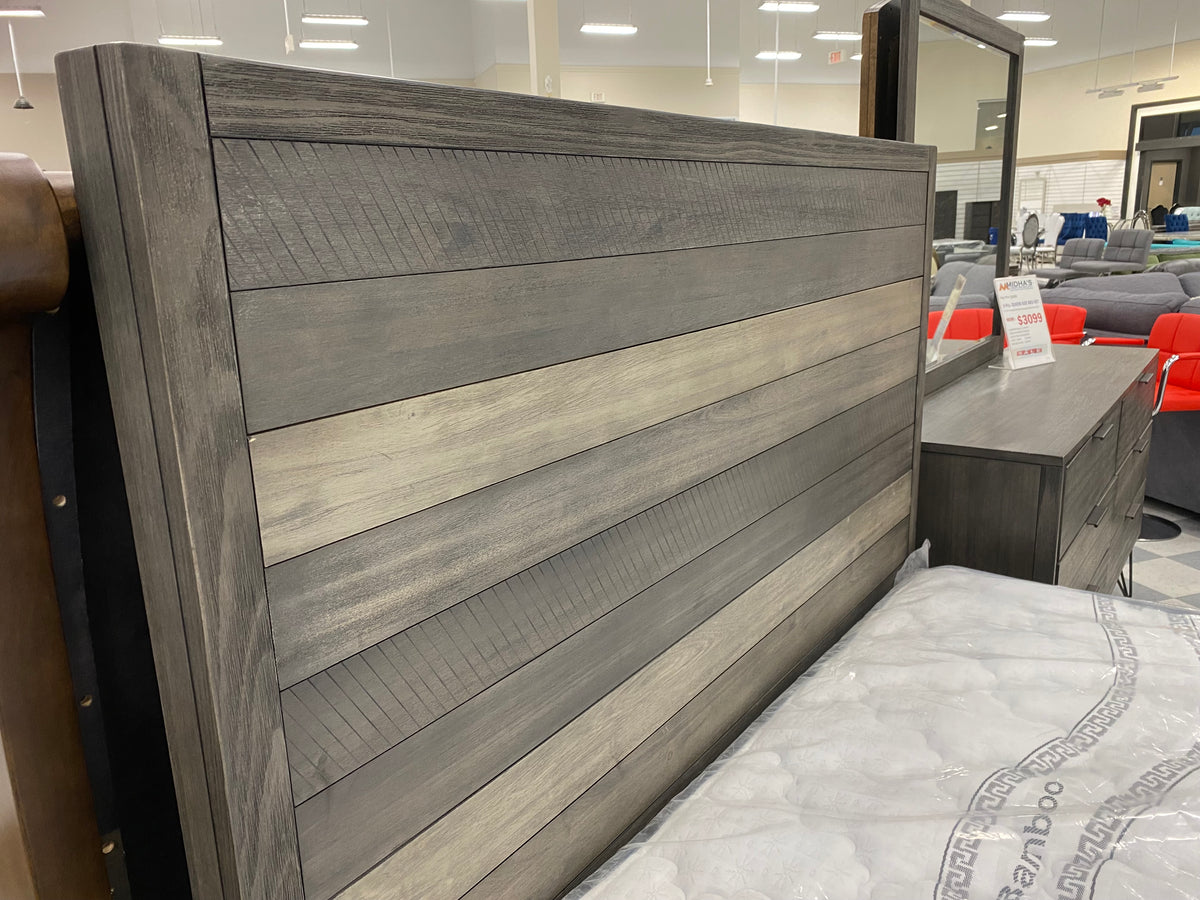 Close-up of Model 1604 grey wood plank headboard with varied tones and textured details