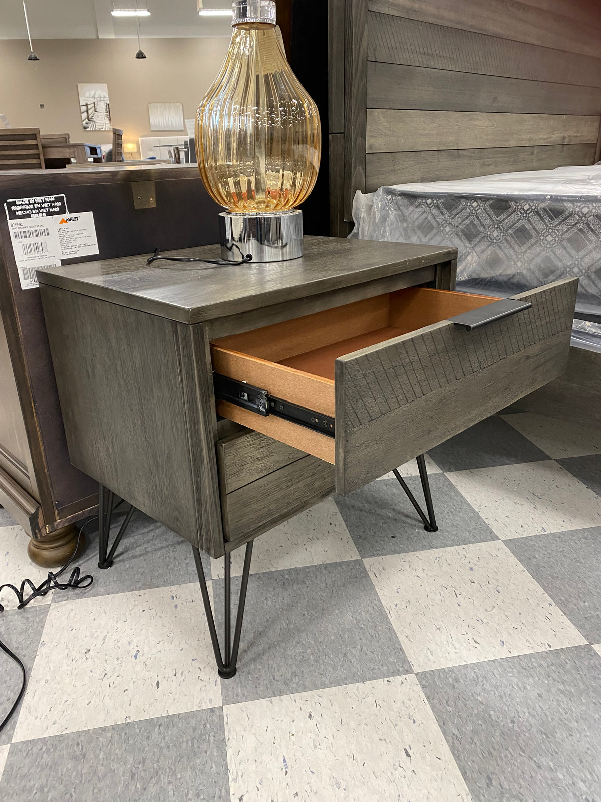 Model 1604 grey nightstand with open drawer showing wood interior and metal slides