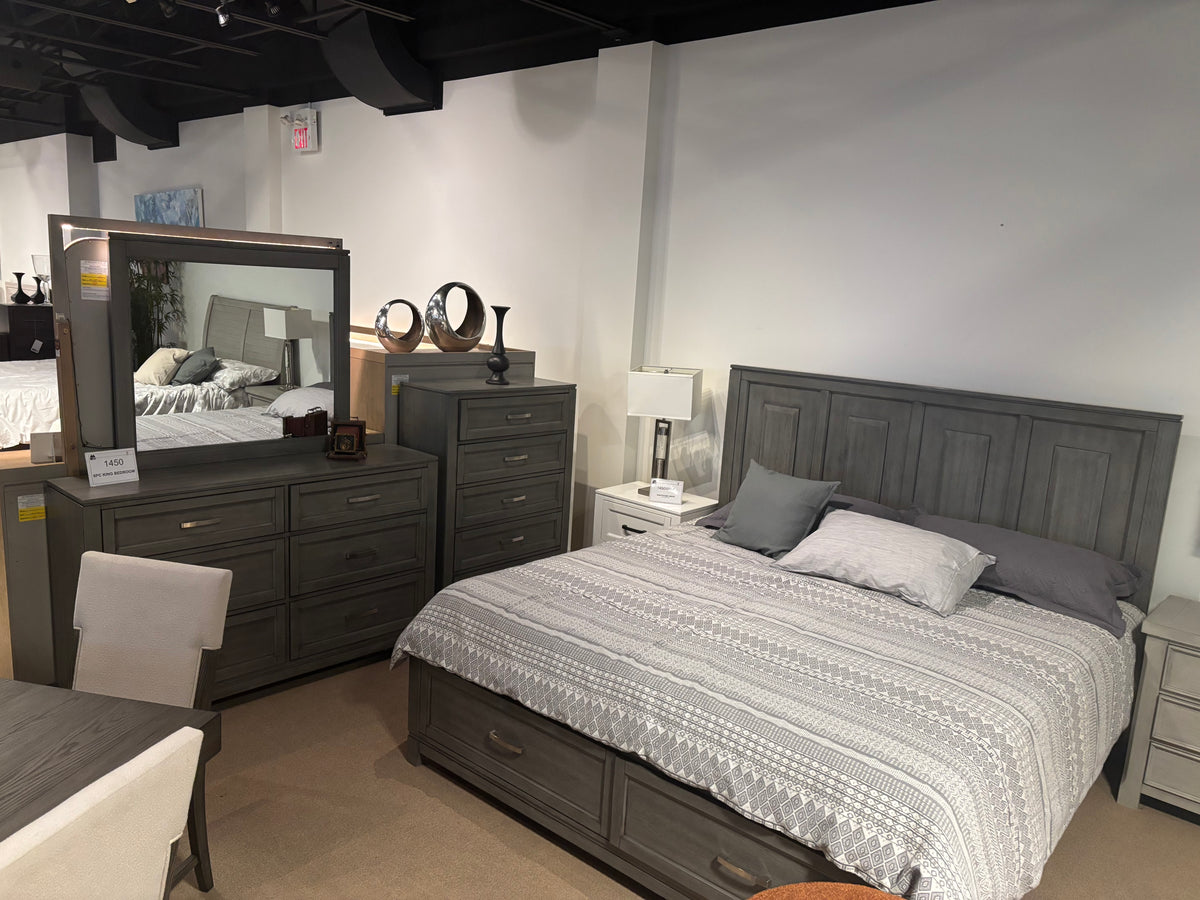 Model 1450 grey bedroom set with panel bed, two-drawer storage footboard, dresser, mirror, chest, and nightstands