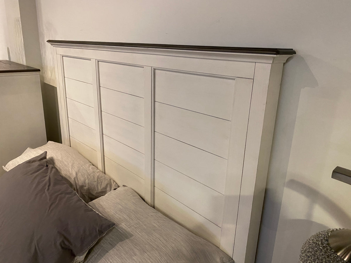 Model 1463 white panel bed with contrasting dark wood trim, chest, and nightstand