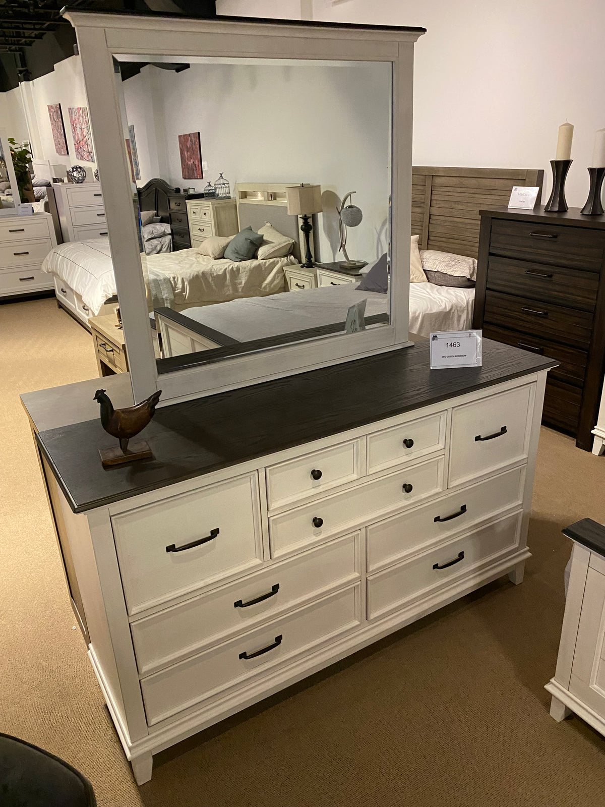 Model 1463 white bedroom dresser with dark wood top, framed mirror, and mixed drawer sizes